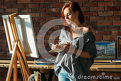 Artist painting studio workspace easel mix palette Stock Photo