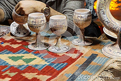 Artist paints unfired pottery Stock Photo