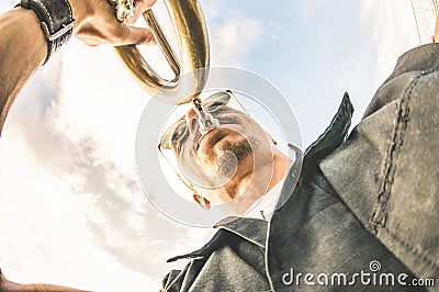 Artist performing trumpet solo jazz against sky - Music and street art concept at open air club location with groove mood Stock Photo