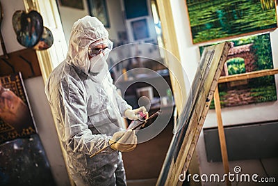 The artist restores the painting Stock Photo