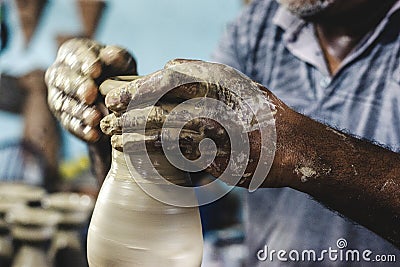 Artist's hands building ceramic pieces Editorial Stock Photo