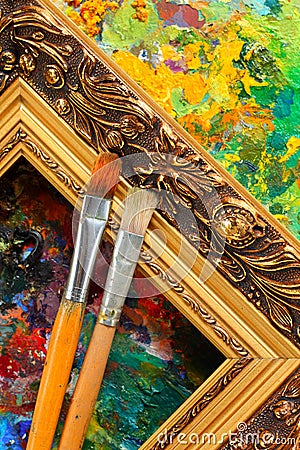 Artist's palette, paintbrushes and frame Stock Photo