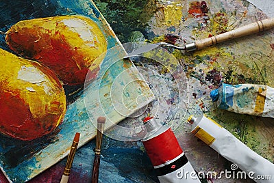 Artist studio with oil paints, brushes and colorful picture Stock Photo