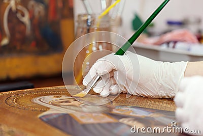 Artist works on the icon Stock Photo