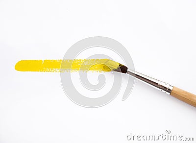 Artist yellow brush and paint scratch. Stock Photo