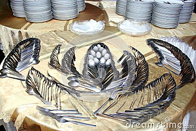 Artistic arrangement of spoons and forks on the table Stock Photo