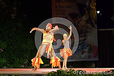 Artistic Colombian dance couple performing on night stage Editorial Stock Photo