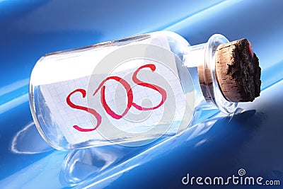 An artistic concept of a vintage bottle saying SOS Stock Photo