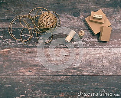 Artistic crafting supplies and art tools of hemp yarn, natural cardboard boxes and stamps for creative homemade gift Stock Photo