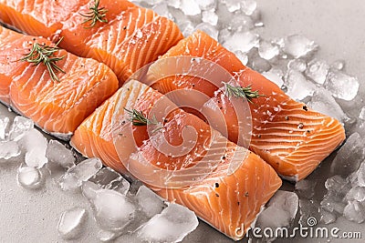 Artistic culinary concept Portioned salmon fillets showcased on ice Stock Photo