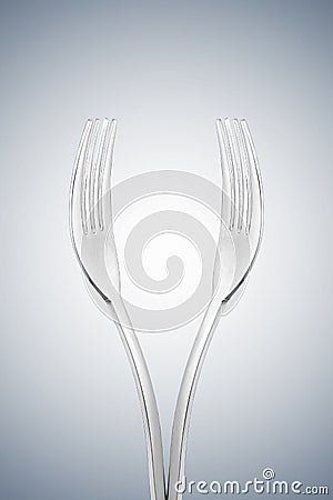 Artistic cup of wine form or hands form made with two forks. Stock Photo