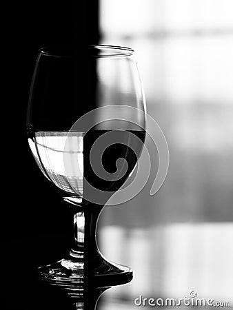 Artistic effect on wine glass filled with water. Stock Photo