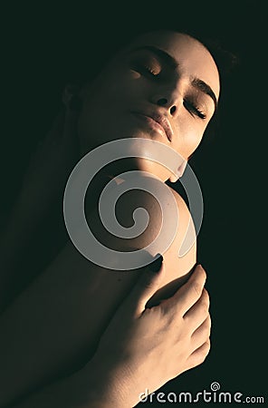 Artistic evocative portrait of a young woman Stock Photo