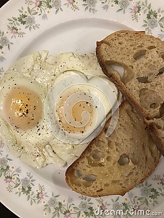 Artistic heart shaped eggs and toast Stock Photo