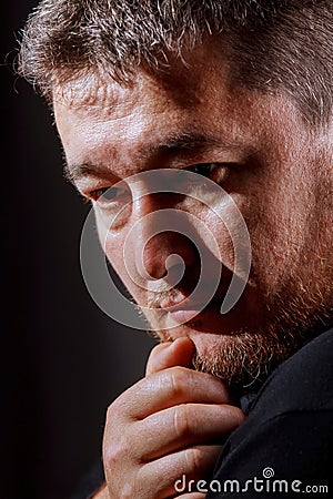 Artistic portrait haired man on black background Stock Photo