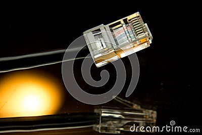 Artistic shot of an ethernet cable and its reflection Stock Photo