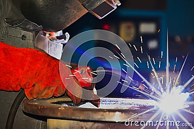 Closeup welding with spark light in factory Stock Photo