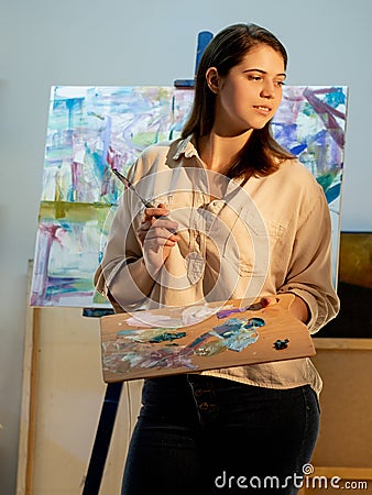 artistic woman painting process creating artwork Stock Photo