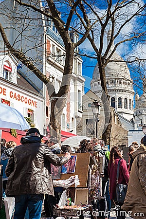 Artists working at the famous Place du Tertre in the Montmartre Editorial Stock Photo