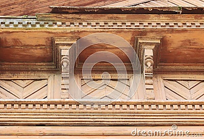 artsy decor trim and classic old wooden house. triangular patterns wood texture brick color. Stock Photo