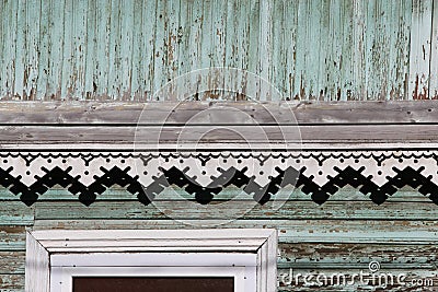 artsy decor trim and classic old wooden house. triangular patterns wood texture turquoise color. Stock Photo