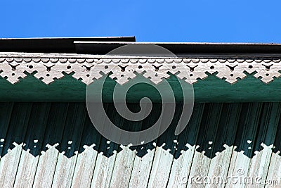 artsy decor trim and classic old wooden house. triangular patterns wood texture turquoise color. Stock Photo