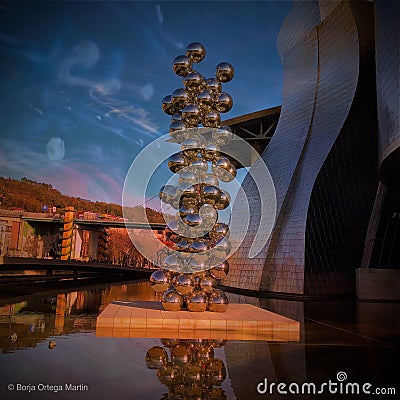 Artsy installation of silver balls near the entrance of the museum of Frank Gehry Guggenheim Editorial Stock Photo