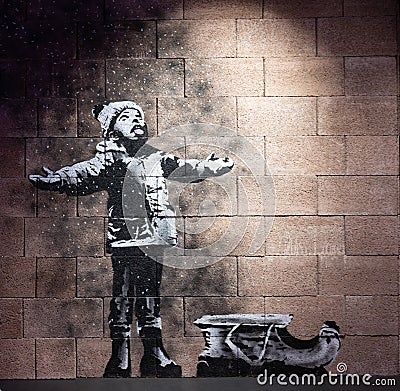 Banksy, `Snow` 2018, art originally on mural by Banksy, anonymous English street graffiti artist Editorial Stock Photo