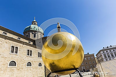 He artwork of Stephan Balkenhol, Man on the golden ball at the R Editorial Stock Photo