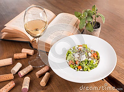 Arugula and pumpkin salad on a wooden table Stock Photo