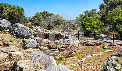 Arzachena, Sardinia, Italy - Archeological ruins of Nuragic complex La Prisgiona - Nuraghe La Prisgiona - with remaining of Editorial Stock Photo