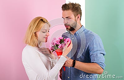 They are as beautiful as you Boyfriend bring bouquet flowers to surprise her. Man giving beautiful flower to lovely Stock Photo