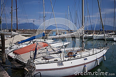 Desenzano del Garda, Italy - July 12, 2022 - yachts and boats docked at the port on Lake Garda on a sunny summer morning Editorial Stock Photo