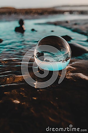 Lensball laying in the sand Stock Photo