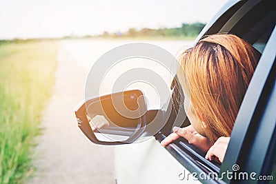 Asain woman traveler with car on Beautiful road Stock Photo