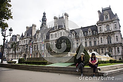 Asain women mother and daughter travel and posing for take photo with Hotel de Ville Editorial Stock Photo