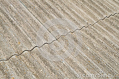 Asbestos cement sheets. Old laid roofing sheets. Stock Photo