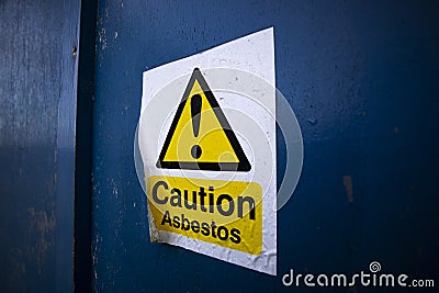 Asbestos warning sign on building Stock Photo