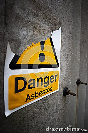 Asbestos warning sign on building Stock Photo