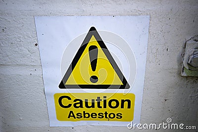 Asbestos warning sign on building Stock Photo