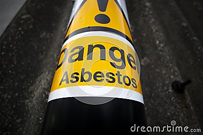 Asbestos warning sign on building Stock Photo