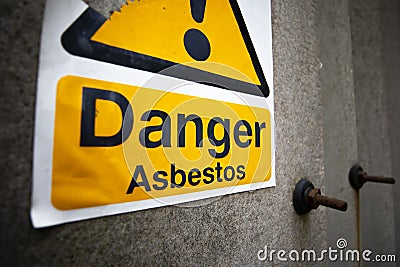 Asbestos warning sign on building Stock Photo