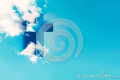 Ascension day concept. Christian Easter. Shining cross in clouds on blue sky. Second coming of Christ. Faith in Jesus Stock Photo