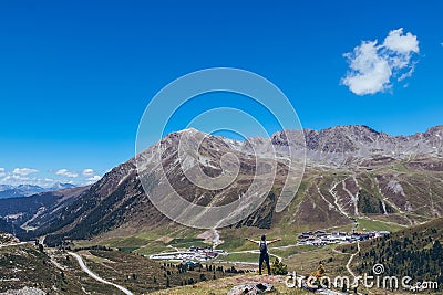 Ascent to the Finstertal dam at the Kuhtai ski resort in western Austria. The backpacker set out on an adventure. A man aged 20-24 Stock Photo