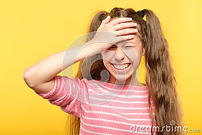 Ashamed smiling girl cover forehead hand embarrass Stock Photo