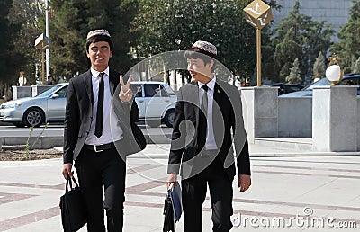 Ashgabad, Turkmenistan - October 10, 2014. Two cheerful student Editorial Stock Photo