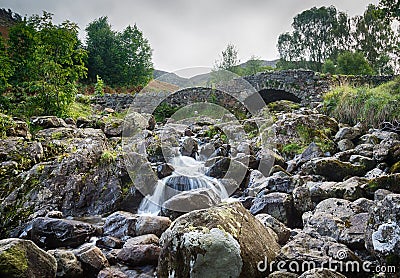 Ashness Bridge over small stream in Lake District Stock Photo