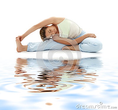 Ashtanga yoga on white sand Stock Photo