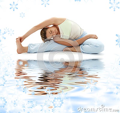 Ashtanga yoga on white sand Stock Photo