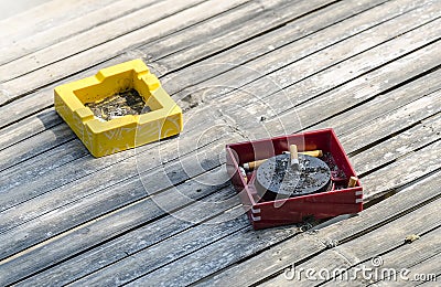 Ashtrays on bamboo table Stock Photo